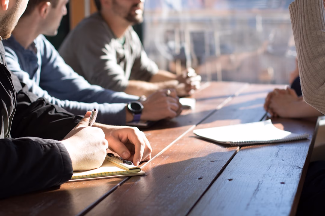 corporate venture capital innovation — boardroom meeting with venture investors reviewing startup pitch deck