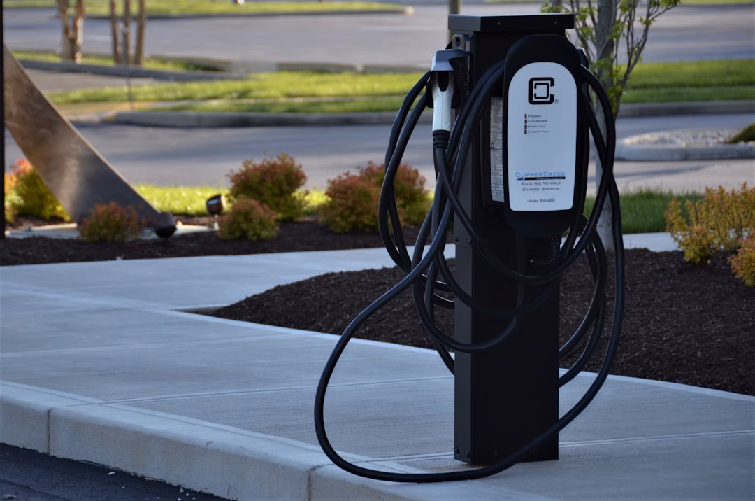 in-car digital commerce new — EV charging station with integrated payment kiosk display
