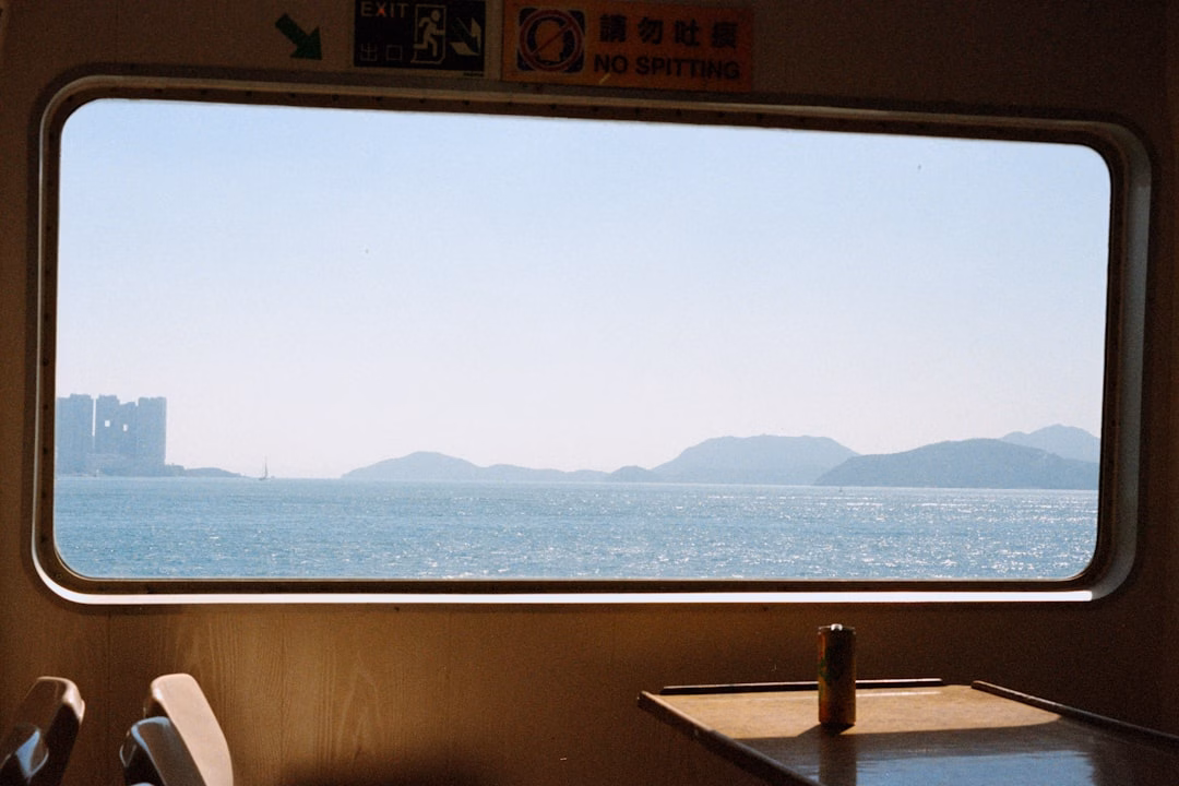 rail tourism comeback around — luxury dining car with panoramic windows overlooking mountain scenery