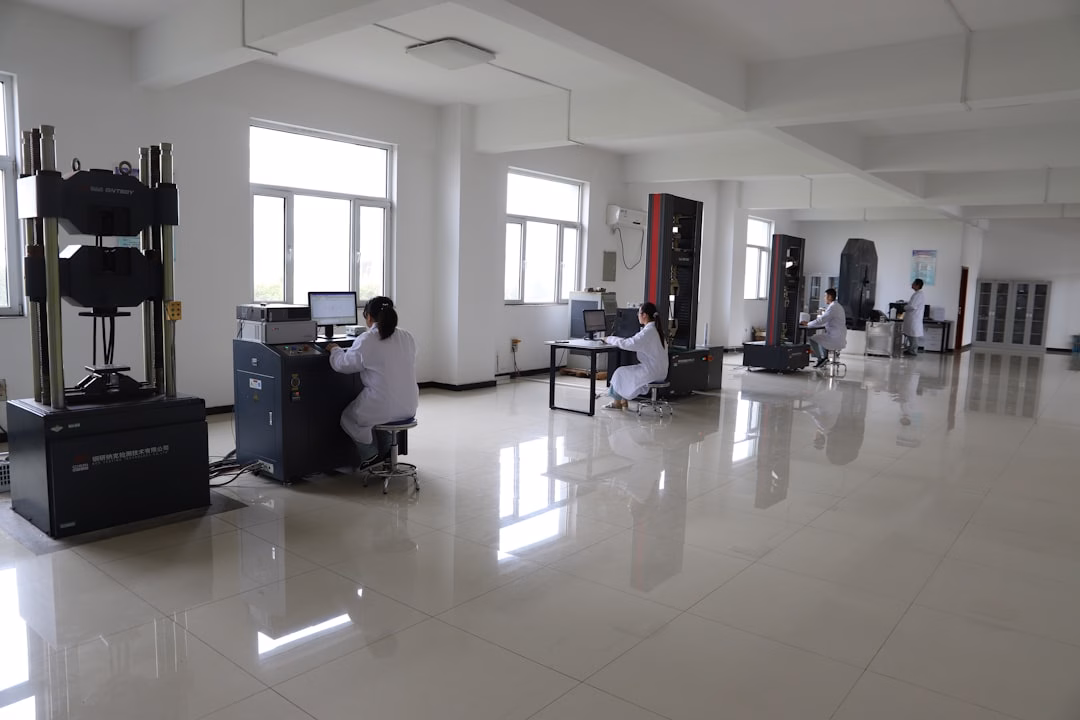 advanced materials product engineering — researchers examining composite materials under laboratory lighting