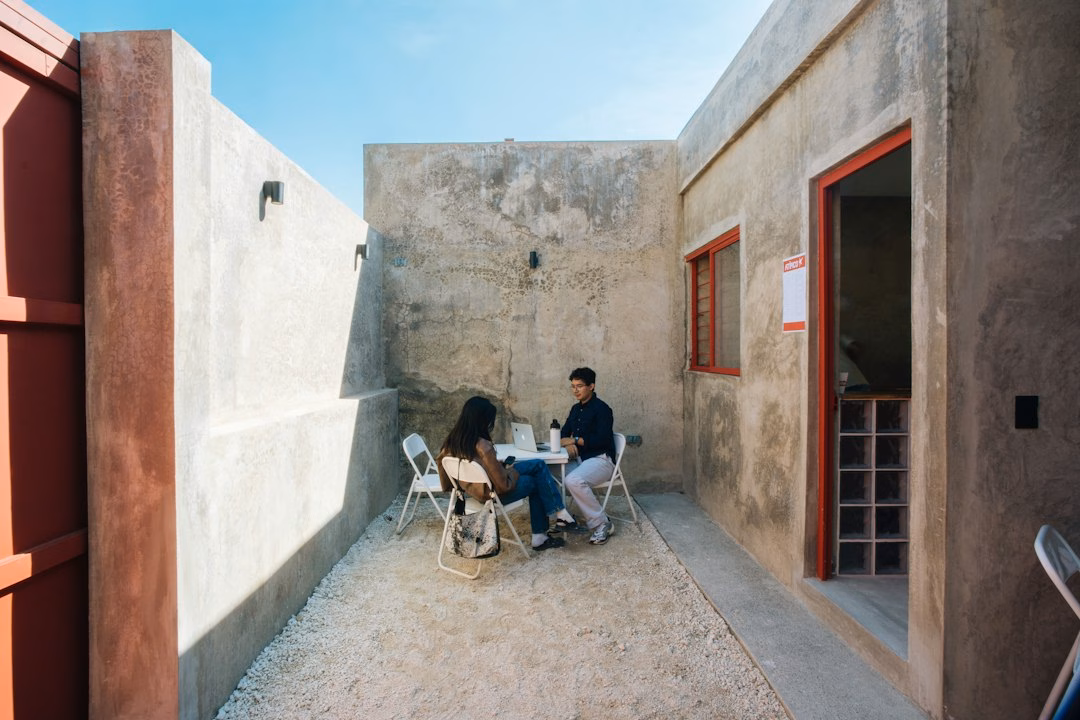 outdoor learning modern education — students collaborating outdoors with natural lighting and open sky